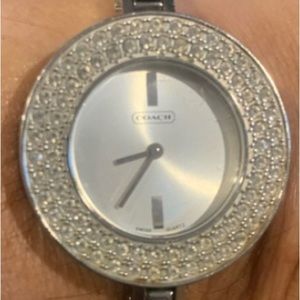 Coach watch with interchangeable bezels